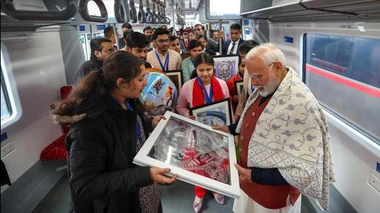 Prime Minister Shri Narendra Modi interacts with students and loco pilots on Namo Bharat train